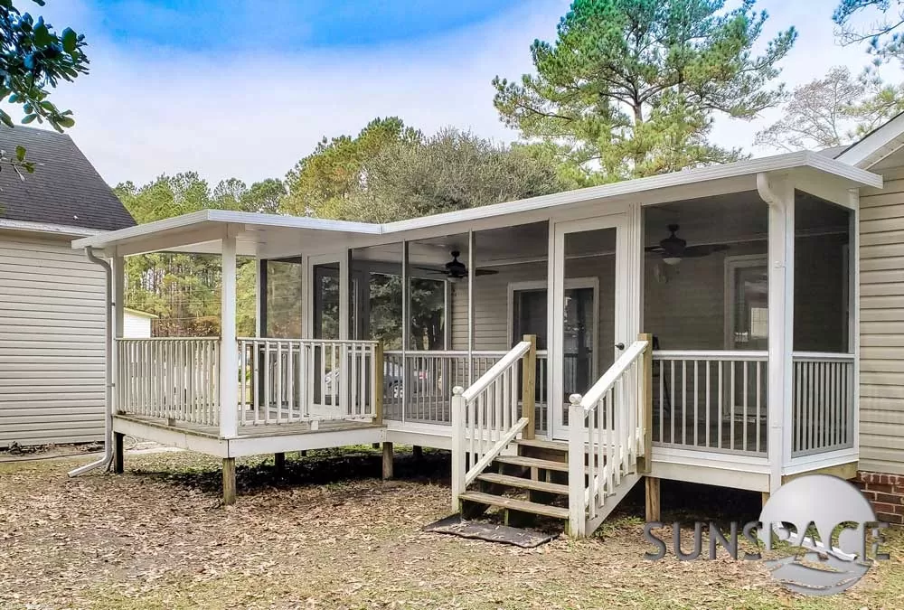 L-shaped Sunspace screen porch with railings
